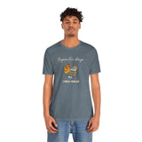 Heather blue short-sleeve T-shirt with front chicken-and-eggs print, worn by model