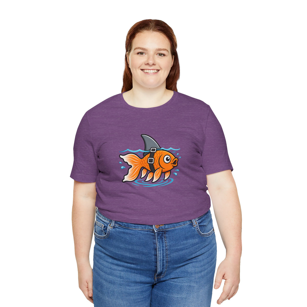 Purple crewneck T-shirt with orange fish graphic, model from waist up