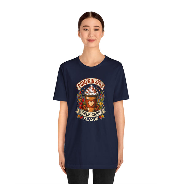 Navy crew-neck T-shirt with “Pumpkin Spice Self Care Season” graphic at center chest