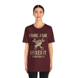 Maroon crewneck T-shirt with “I came. I saw. I fixed it (eventually)” slogan and wrench icon