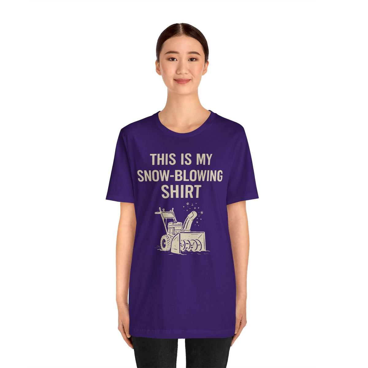 Purple crewneck short-sleeve T-shirt with snow blower graphic and bold winter slogan on front