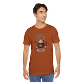 Burnt orange t-shirt with “Professional Pumpkin Spice Taster” front graphic on model