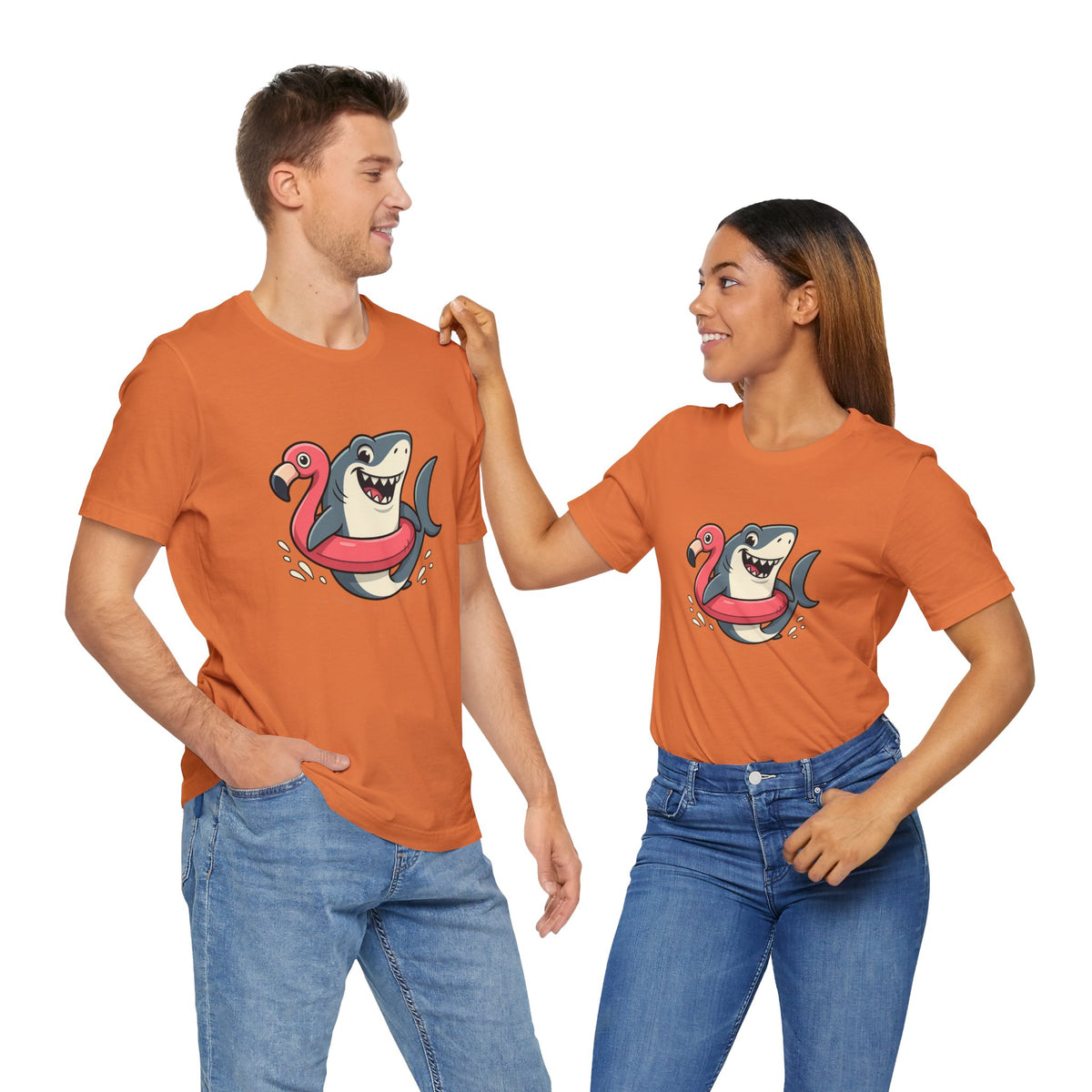 Orange crewneck T-shirts with shark and flamingo floatie graphic, two models standing.