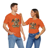 Orange unisex crewneck t-shirts on two models, meditating Cthulhu graphic on both