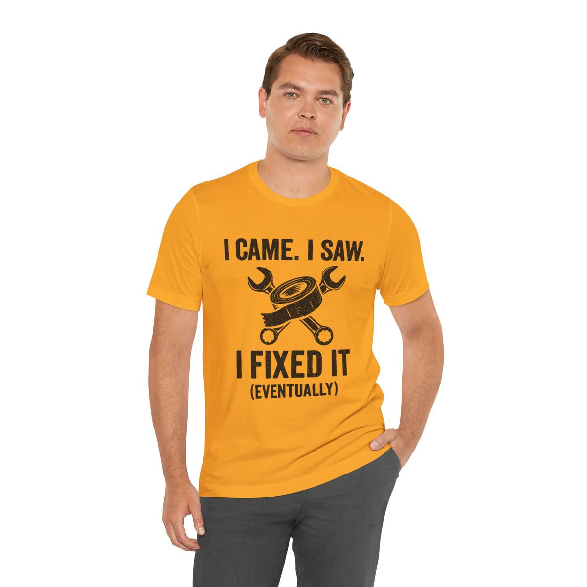 Orange crew-neck T-shirt with black repair-themed print and quote "I FIXED IT"
