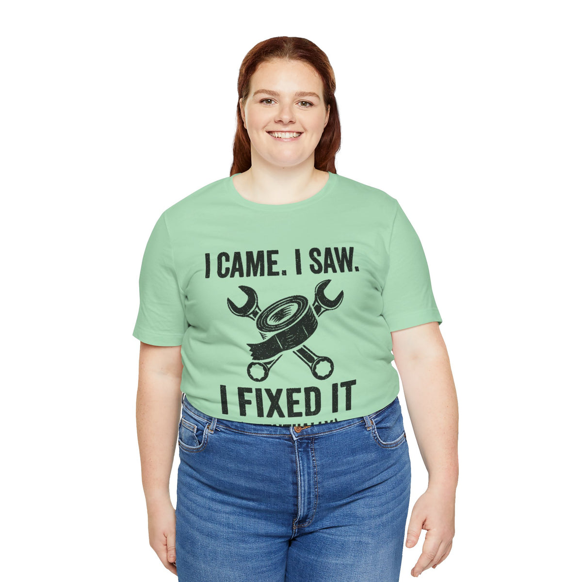 Mint green crew-neck T-shirt featuring black repair-themed quote “I fixed it (eventually)”