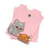 Pink crew-neck T-shirt with cute gray cat and brown roast graphic on chest.