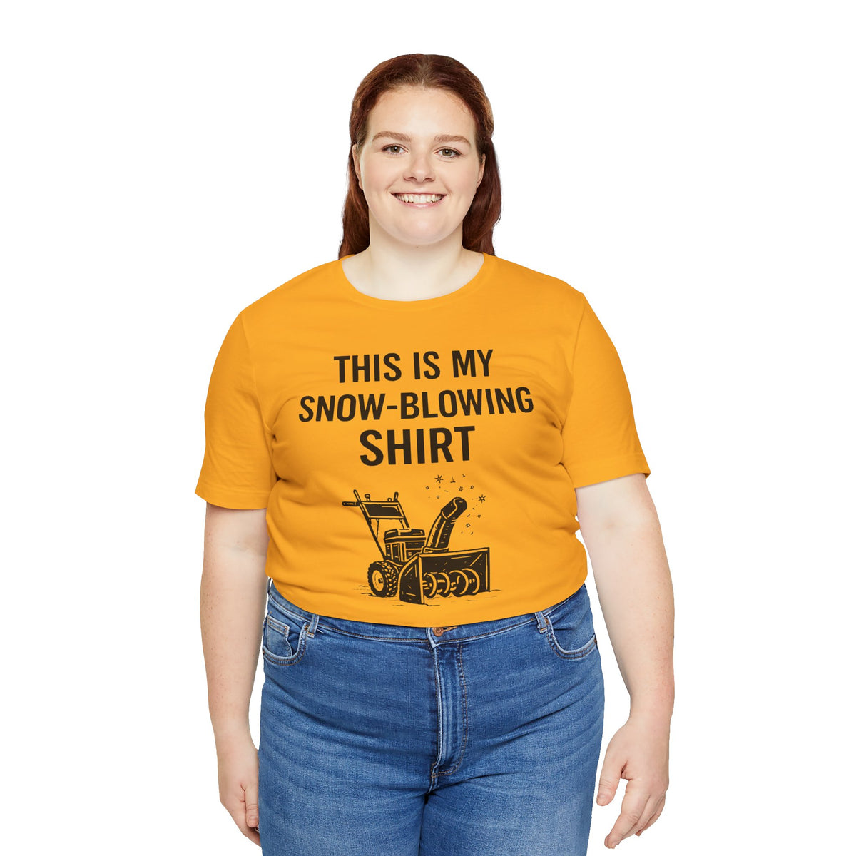 Orange short-sleeve T-shirt with “THIS IS MY SNOW-BLOWING SHIRT” text and snow blower graphic.