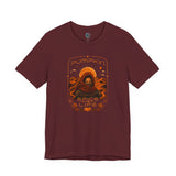 Maroon crewneck T-shirt with orange pumpkin sci-fi face graphic on the front