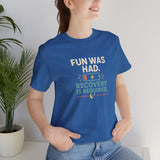 Blue crewneck T-shirt with front “Fun Was Had” recovery graphic worn by woman