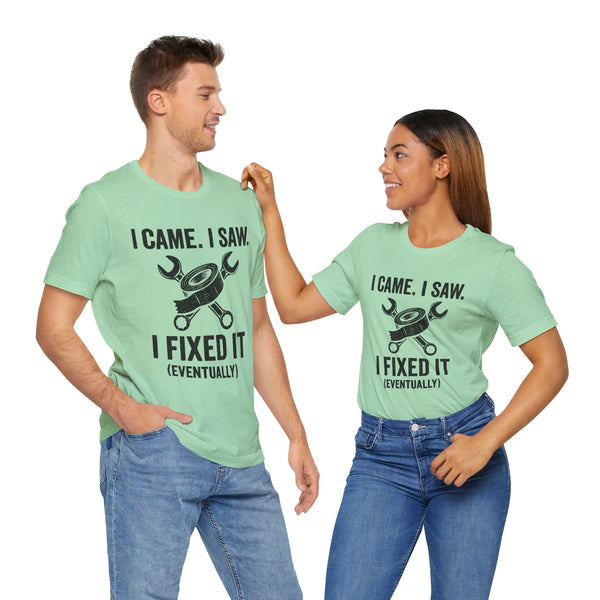 Two mint green crew-neck T-shirts with black “I fixed it (eventually)” quote and tool icon