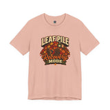 Leaf pile graphic recovery mode T-shirt in peach with fall leaves front print