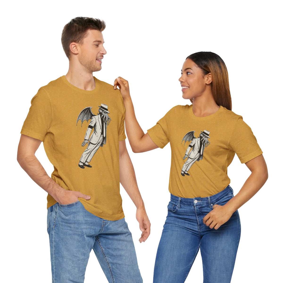 Mustard crew-neck t-shirt with gray monster graphic print, worn with jeans