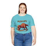 Turquoise T-shirt with T-rex 'Push-Ups' front graphic, worn by woman