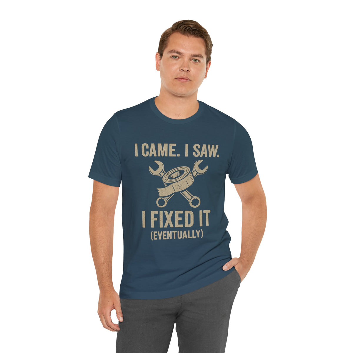 Teal short-sleeve T-shirt with crew neck; “I came, I saw, I fixed it (eventually)” slogan