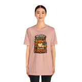 Blush pink crew-neck t-shirt with pumpkin graphic on front, front view