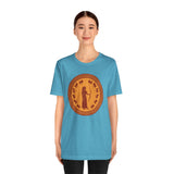 Sky blue crewneck T-shirt with large orange circular Greek-style goddess graphic