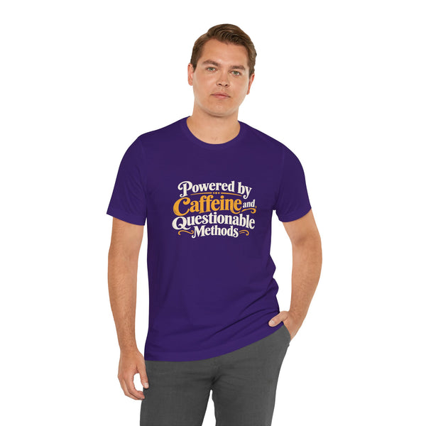 Purple crewneck T-shirt with centered “Powered by Caffeine and Questionable Methods” print.