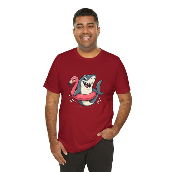 Red crewneck T-shirt with cartoon shark hugging a pink flamingo front graphic