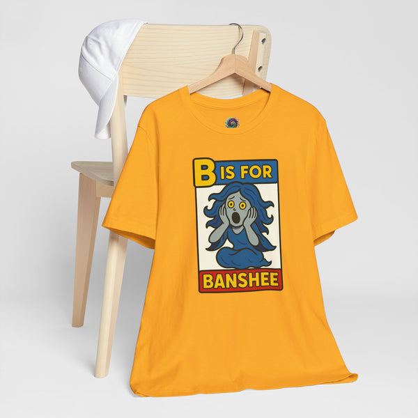 Gold short-sleeve T-shirt with “B is for Banshee” illustrated square graphic