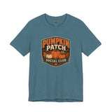 Deep teal graphic T-shirt with Pumpkin Patch Social Club pumpkin logo