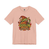 Peach crew-neck graphic t-shirt with goblin mascot and colorful 'Goblin Mode' print