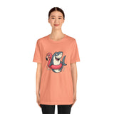 Coral crewneck T-shirt with shark and flamingo floatie graphic, straight hem