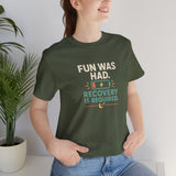Dark green crew-neck t-shirt with colorful social battery graphic on chest.