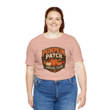 Peach crewneck T-shirt with Pumpkin Patch Social Club pumpkin emblem