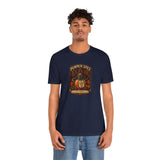 Navy short-sleeve T-shirt with pumpkin spice elixir front graphic, model wearing it