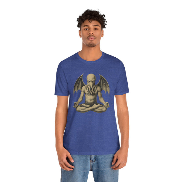 Blue unisex T-shirt featuring a meditating monster illustration centered on front