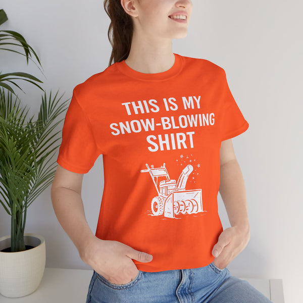 Orange crew-neck T-shirt on model, front “This is my snow-blowing shirt” text graphic