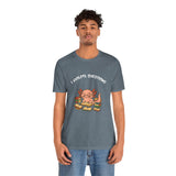 Heather blue-gray crew-neck T-shirt with axolotl reading-books graphic on the chest.