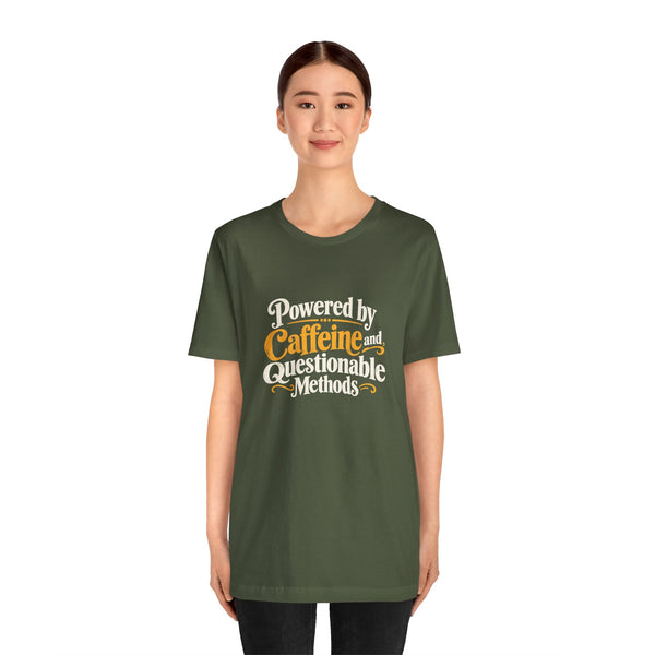 Military green crewneck tee with “Powered by Caffeine and Questionable Methods” front graphic