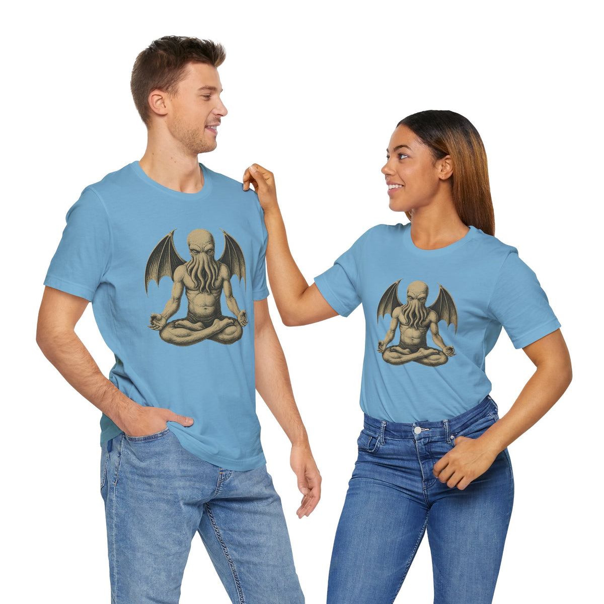 Pair of light blue unisex crewneck t-shirts with meditating monster chest graphics