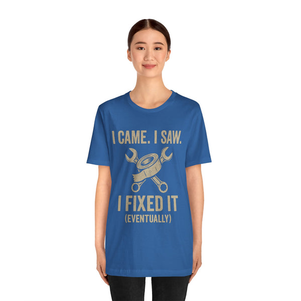 Blue crewneck T-shirt featuring gold “I Came, I Saw… I Fixed It (Eventually)” text and icon.