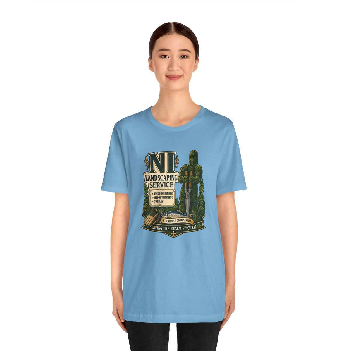 Light blue crewneck T-shirt with green shrub and cactus logo on chest