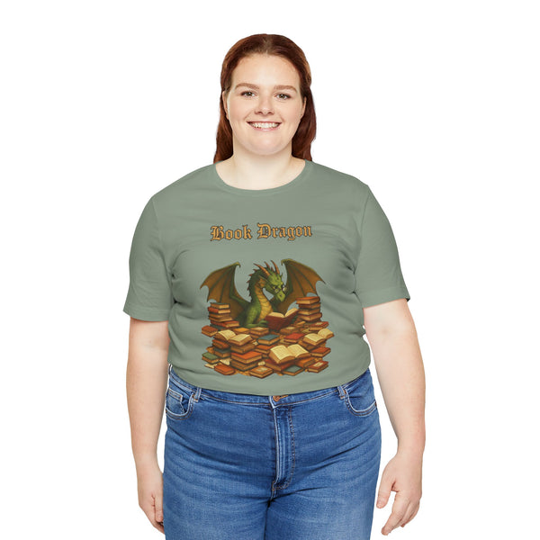 Sage green t-shirt with dragon and stacked book illustration, front view
