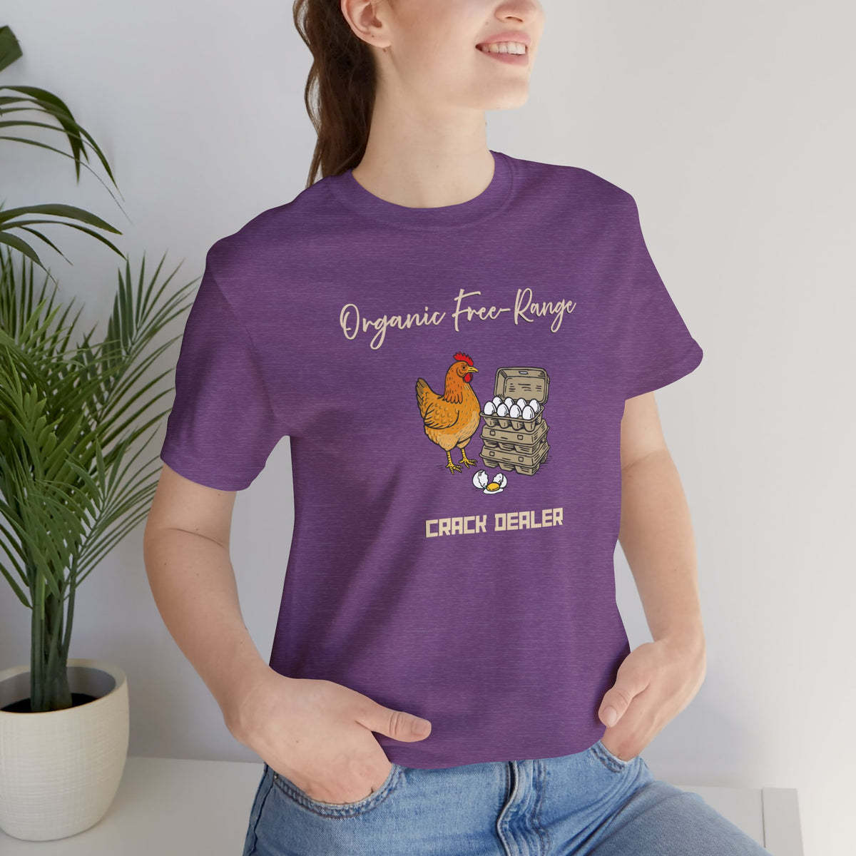 Purple crewneck T-shirt with chicken-and-eggs graphic and “Crack dealer” slogan, close-up