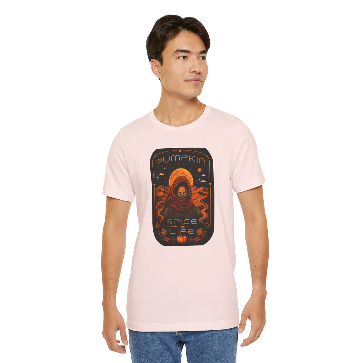 Light pink crewneck T-shirt with orange sci-fi pumpkin graphic centered
