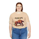 Beige crewneck T-shirt with 'PUSH-UPS' T-rex workout graphic, front view
