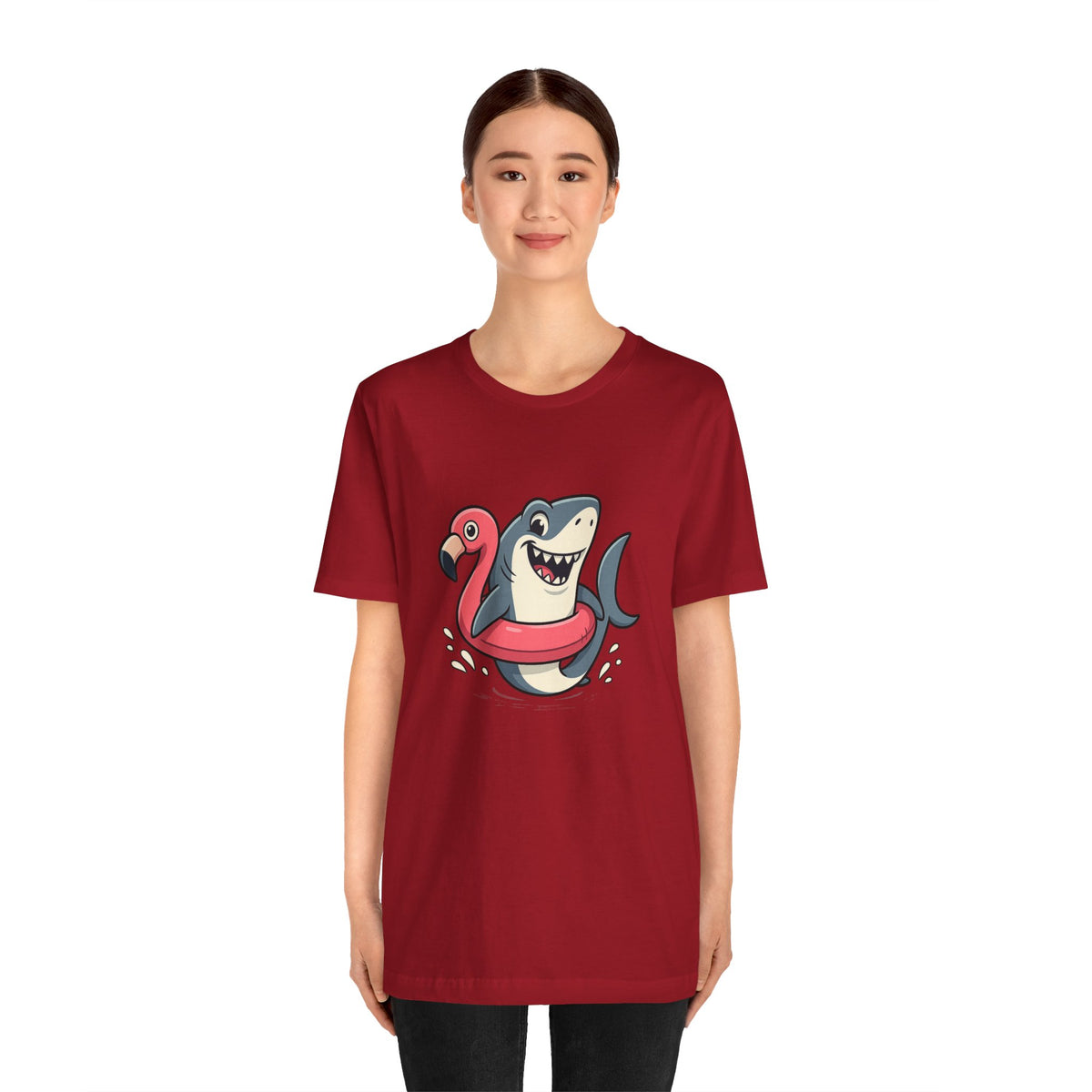 Red crewneck short-sleeve T-shirt with cartoon shark and pink flamingo graphic at center
