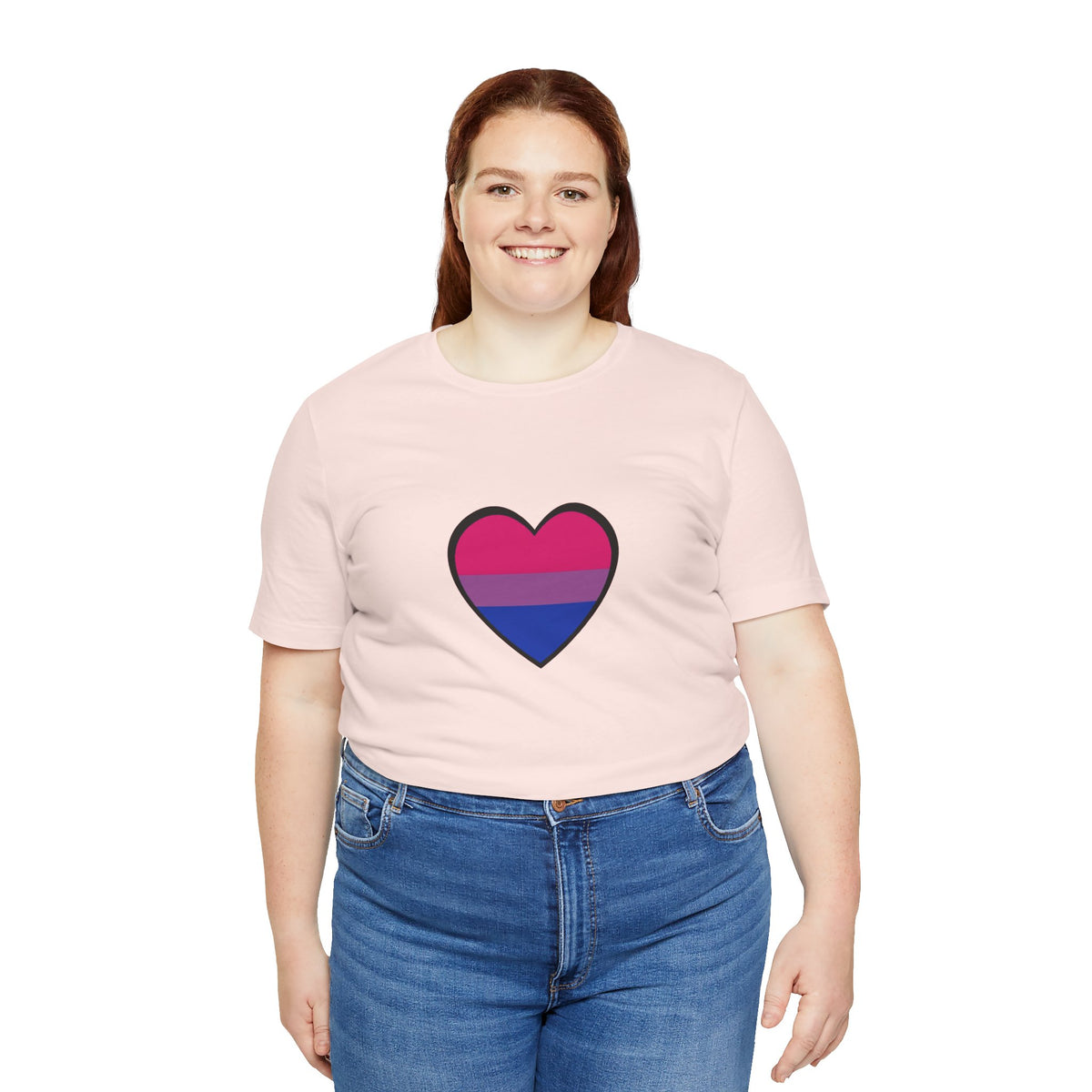 Soft pink Pride heart t-shirt showing rainbow heart graphic on front