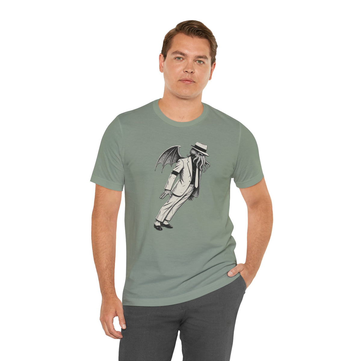 Sage green crew-neck T-shirt with front illustration of top-hat figure and wings