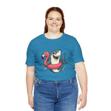 Aqua blue t-shirt with smiling shark and pink flamingo floatie graphic