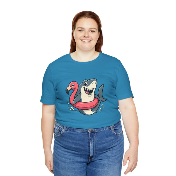 Aqua blue t-shirt with smiling shark and pink flamingo floatie graphic