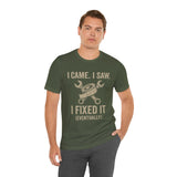 Fix-it humor T-shirt in dark green with repair-themed quote and crossed tools graphic