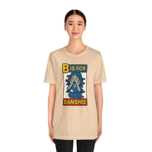 Beige short-sleeve T-shirt with “B is for Banshee” Halloween graphic on the chest