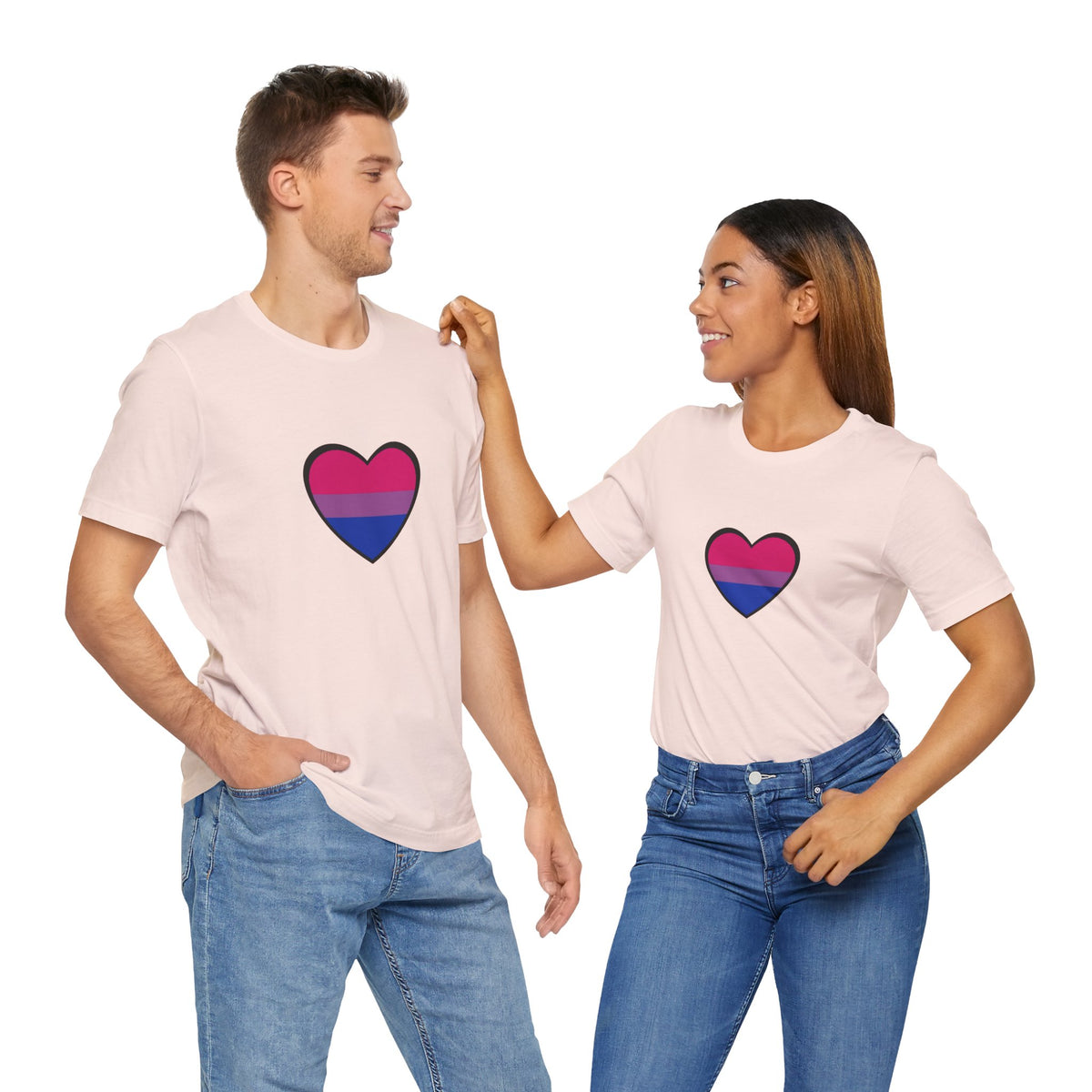 Soft pink Pride heart t-shirt featuring rainbow heart graphic, worn by two people