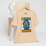 Tan short-sleeve T-shirt with B is for Banshee ghost letter graphic on chest
